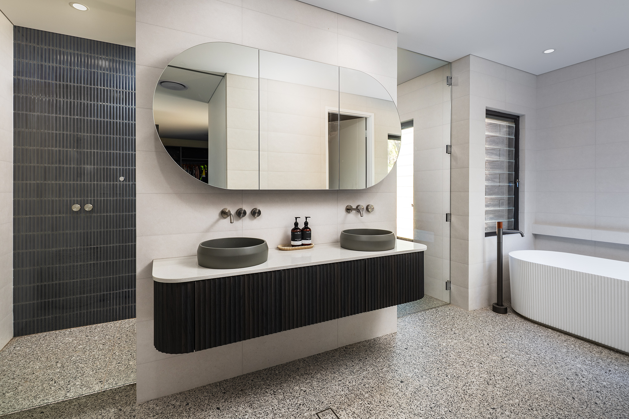 Modern bathroom cabinetry with flat panel fronts